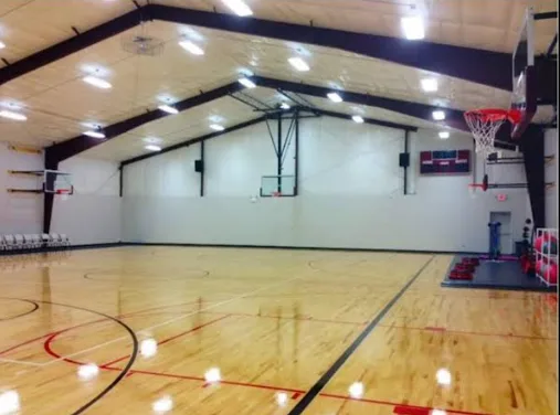 Steel clear-span gymnasium with full basketball court