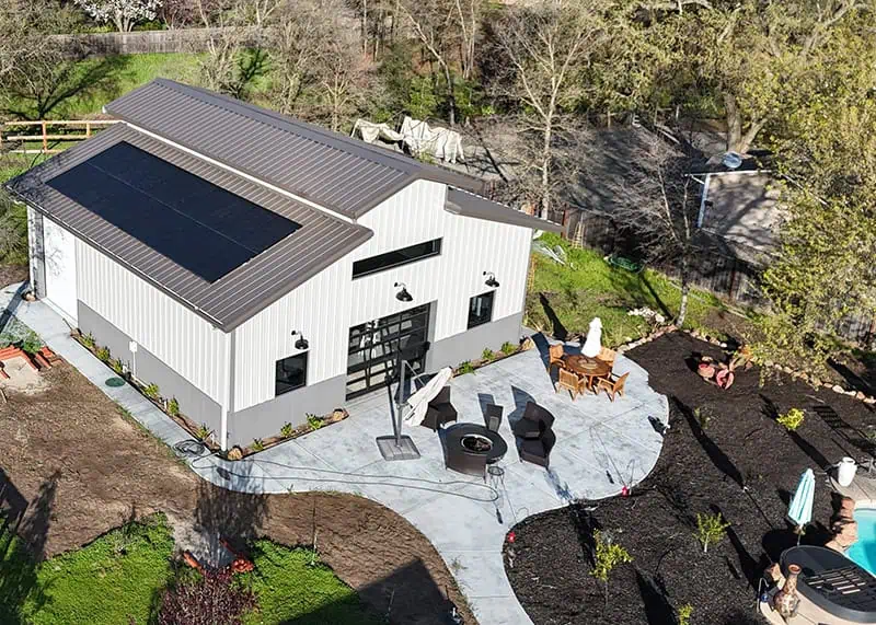 Aerial view of residential steel building with solar panels