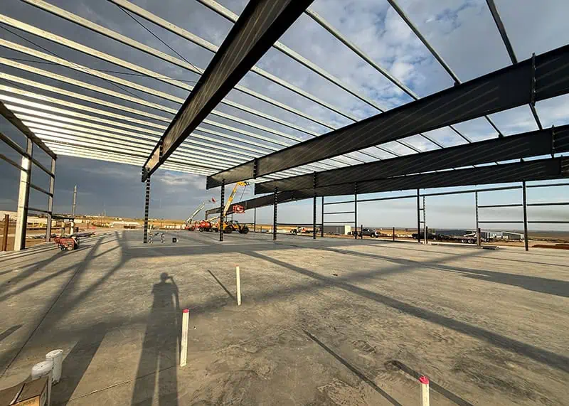 Steel portal frame structure being erected at a job site